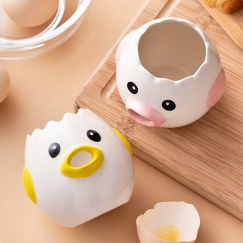 Two pink egg and yolk separators with serrated, chick-inspired designs, ideal for quickly separating egg whites from yolks in the kitchen.