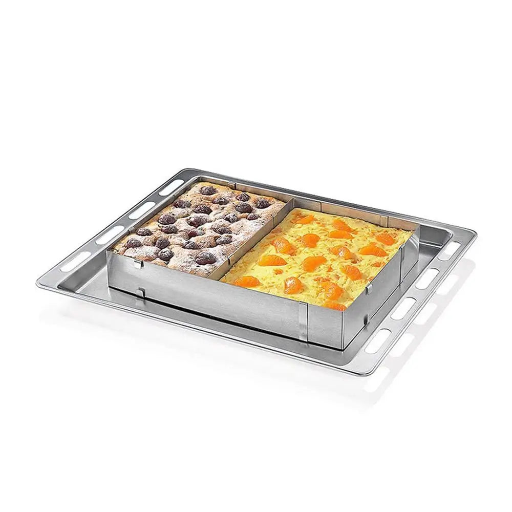 Expandable cake ring on a baking tray with divided cake sections for layered baking and dessert preparation.