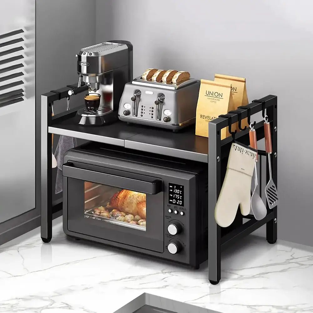 Expandable microwave shelf stand with microwave below and coffee machine, toaster, and utensils organized above.