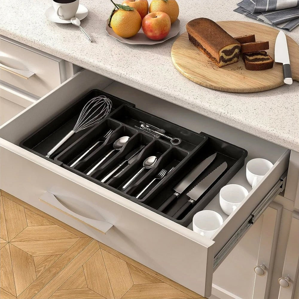 Expandable silverware drawer organizer with six compartments, adjusts to 22.4" for versatile storage.