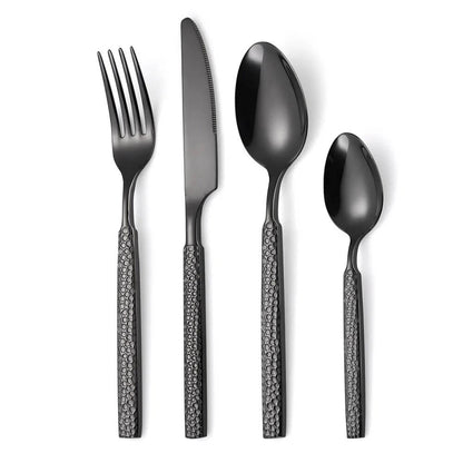 A modern flatware set consisting of a fork, knife, tablespoon, and teaspoon, all featuring a sleek matte black finish. The handles have a textured, honeycomb-like pattern, adding a contemporary and stylish detail to the design. The smooth, reflective surfaces of the utensils contrast elegantly with the textured handles, creating a bold and sophisticated aesthetic. The set is displayed on a clean white background, highlighting its minimalist and modern appeal.