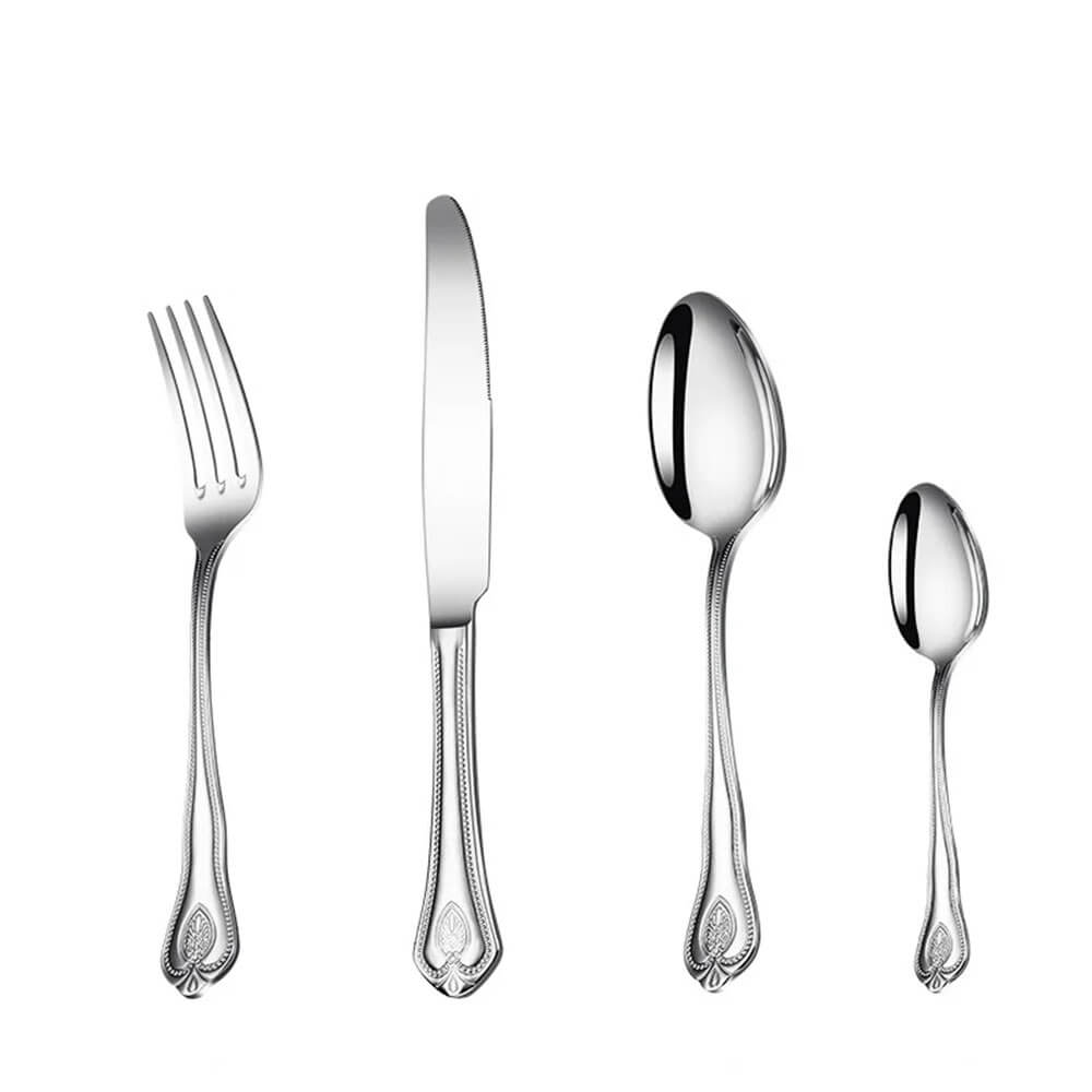 A silver flatware set displayed on a white background, including a fork, knife, tablespoon, and teaspoon. Each piece features a polished, reflective finish and intricate handle detailing with bead-like patterns and floral motifs. 