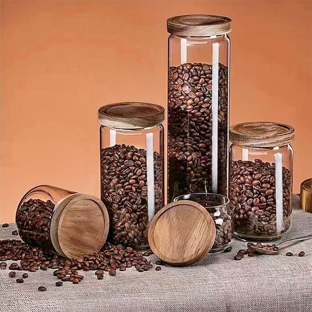 Elegant canisters for flour, sugar, and coffee storage with bamboo lids, ideal for organized kitchens.