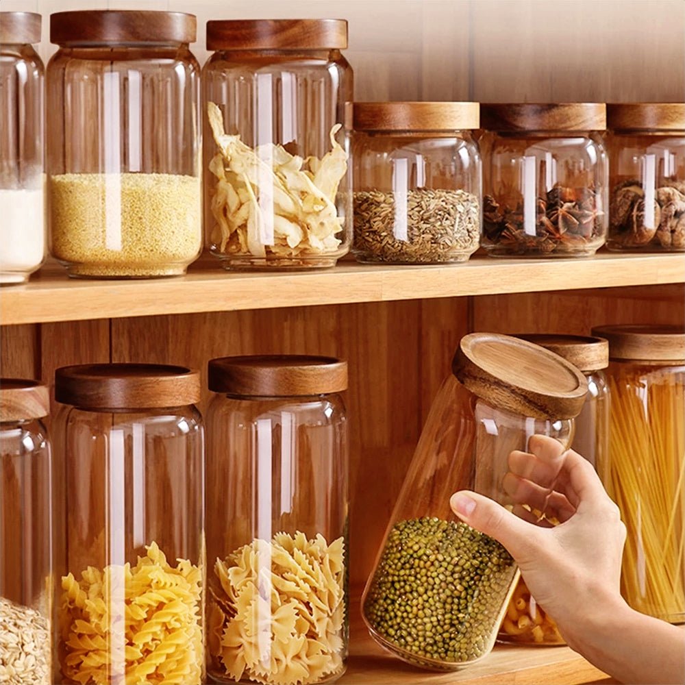 Elegant canisters for flour, sugar, coffee, and tea, featuring bamboo lids for organized and fresh storage.