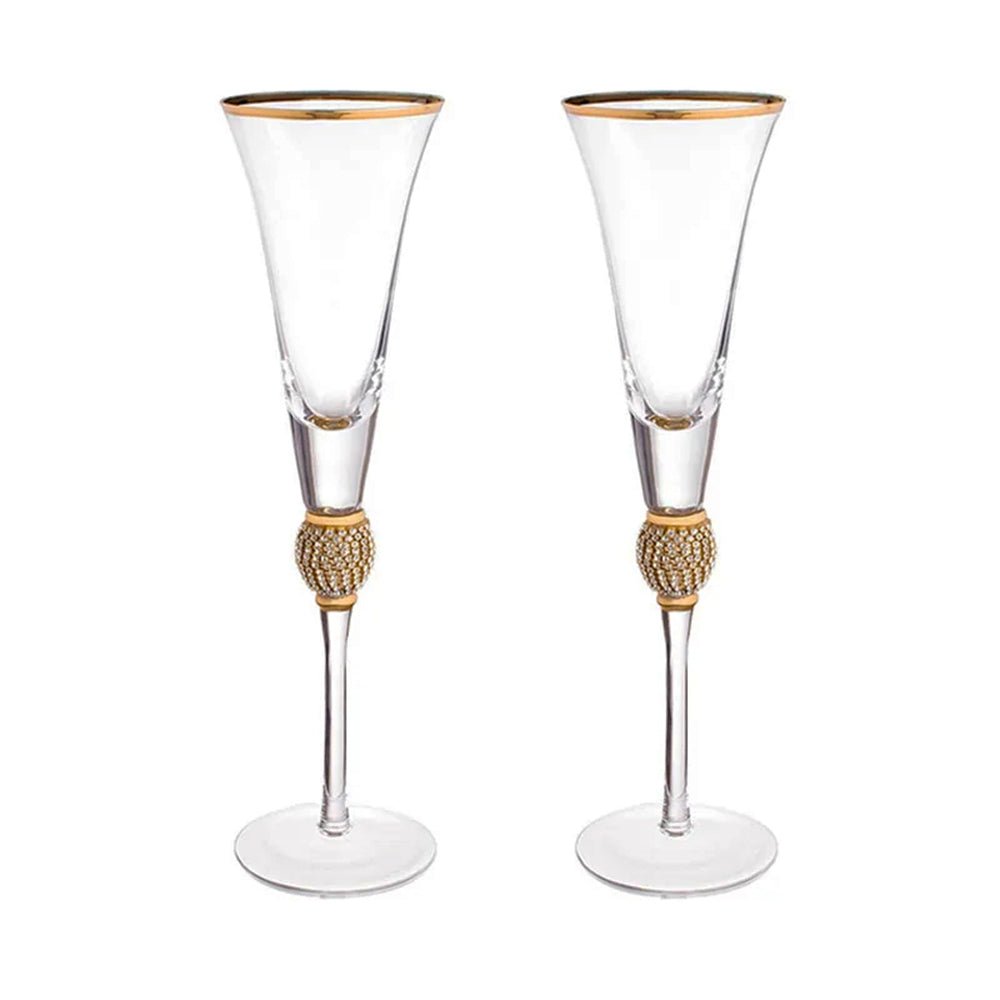 Luxurious flute glasses with a gilded rim and rhinestones that sparkle with every toast.