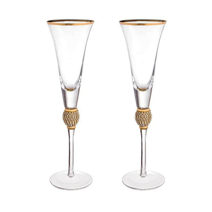 Luxurious flute glasses with a gilded rim and rhinestones that sparkle with every toast.