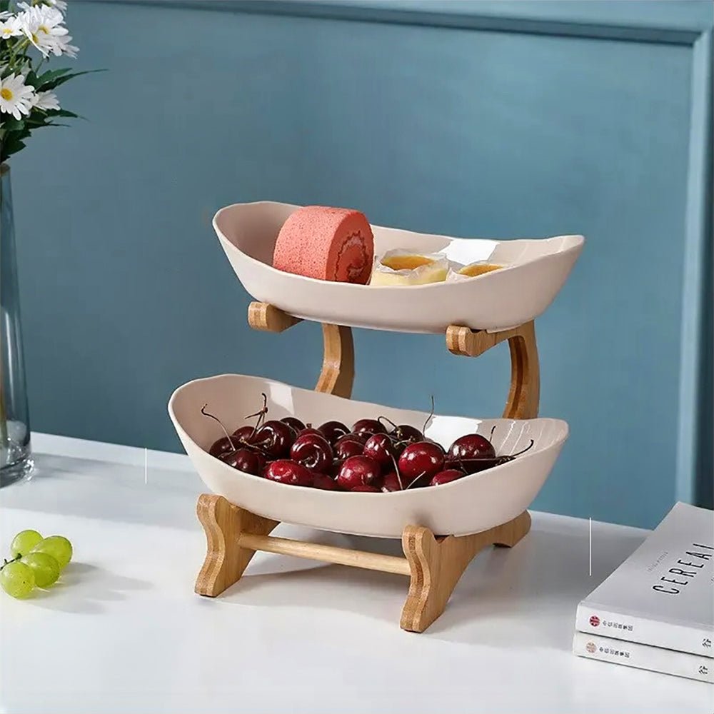 A beige fruit bowl 2-tier design, filled with a variety of fresh fruits and snacks, offering a stylish and practical solution for organized food presentation.