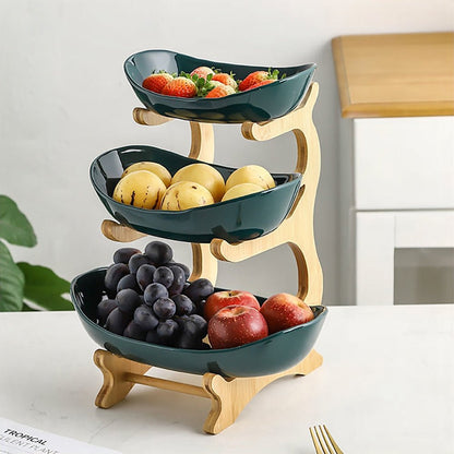 A green fruit bowl with fruit, filled to the brim with a vibrant assortment of fresh, colorful fruits.