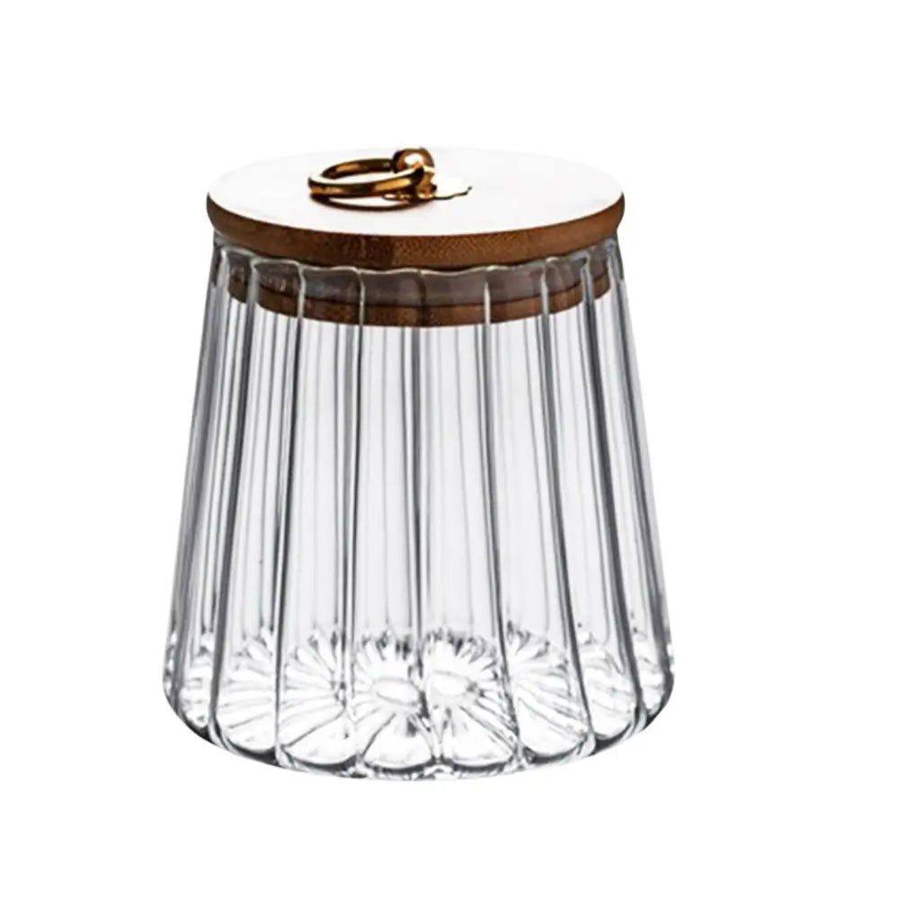 Clear glass container with wooden lid on a white background.