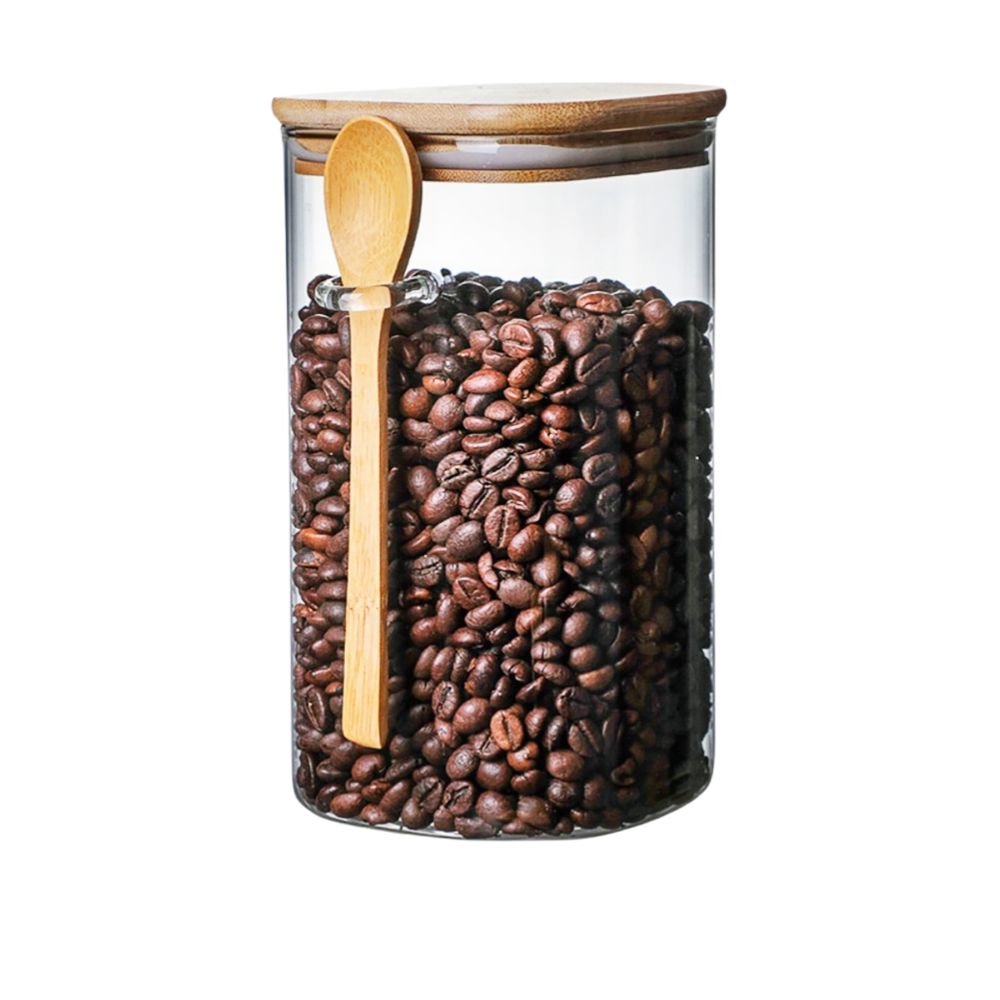 Glass canister with lid, perfect for storing kitchen essentials like coffee, tea, and sugar.