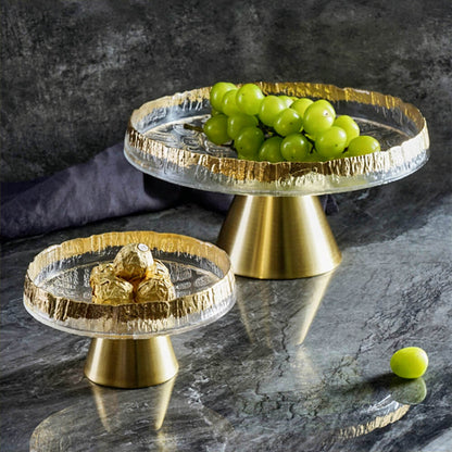 Set of elegant glass footed fruit bowls with textured gold-rimmed edges, featuring a sturdy brass-toned base for a modern and luxurious look. Perfect for presenting fruits, desserts, or chocolates as a stylish table centerpiece.