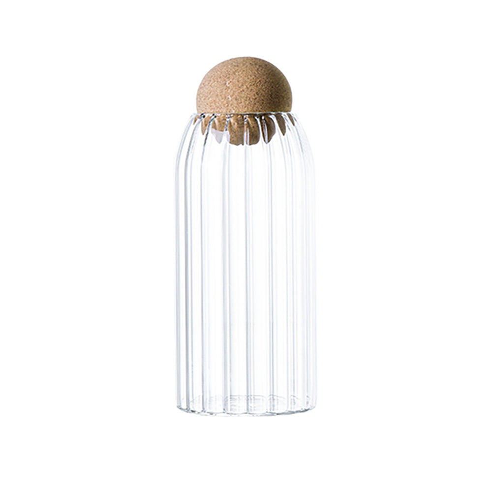 Glass jars with cork ball lids, ideal for stylish kitchen storage of sugar, tea, coffee, and beans.