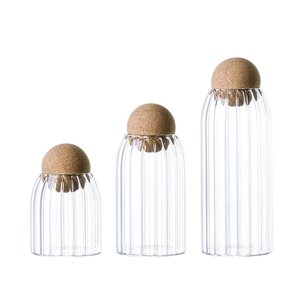 Glass jars with cork lids, ideal for stylish kitchen storage of pantry essentials.