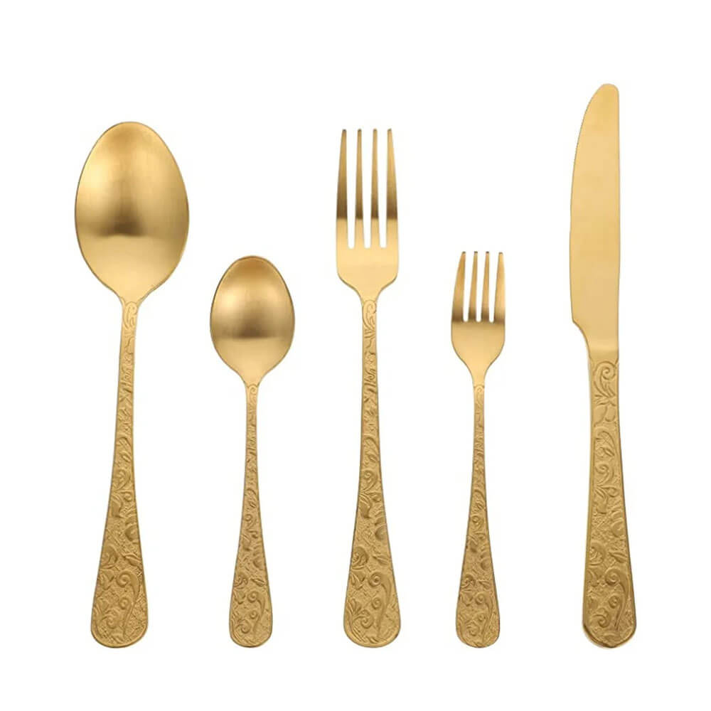 Elegant gold flatware set featuring a knife, two forks, and two spoons with intricate patterns, perfect for upscale dining occasions.