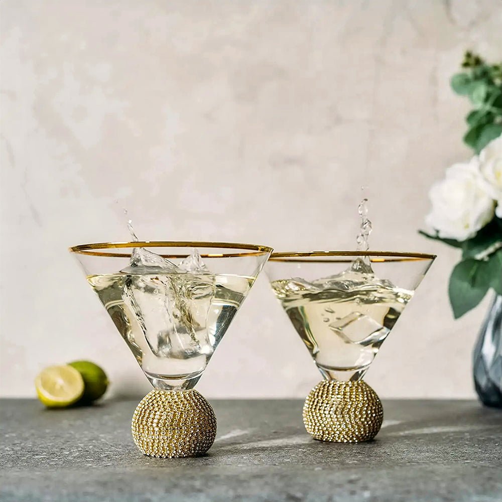 Two elegant gold-rimmed glasses side by side, showcasing a luxurious design, perfect for any occasion.