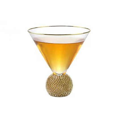 Elegant gold rimmed glass with jeweled base and diamond-embedded jewel ball, perfect for luxurious sipping.