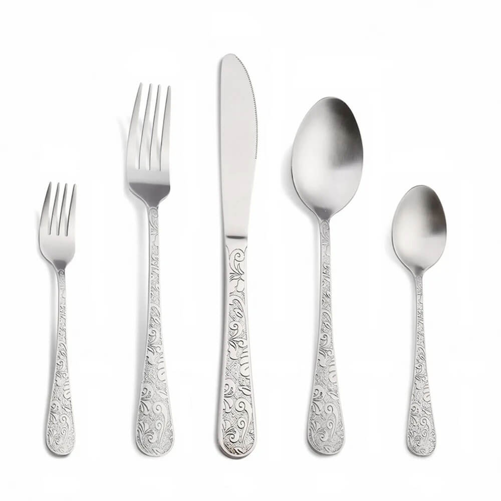 Elegant stainless steel cutlery set with intricate designs, ideal for complementing gold-silverware sets in sophisticated table settings.