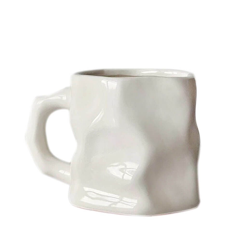 A minimalist white hand-glazed mug featuring a crumpled texture design. The smooth, glossy finish enhances its unique craftsmanship, while the sturdy handle offers a comfortable grip, making it both stylish and functional.