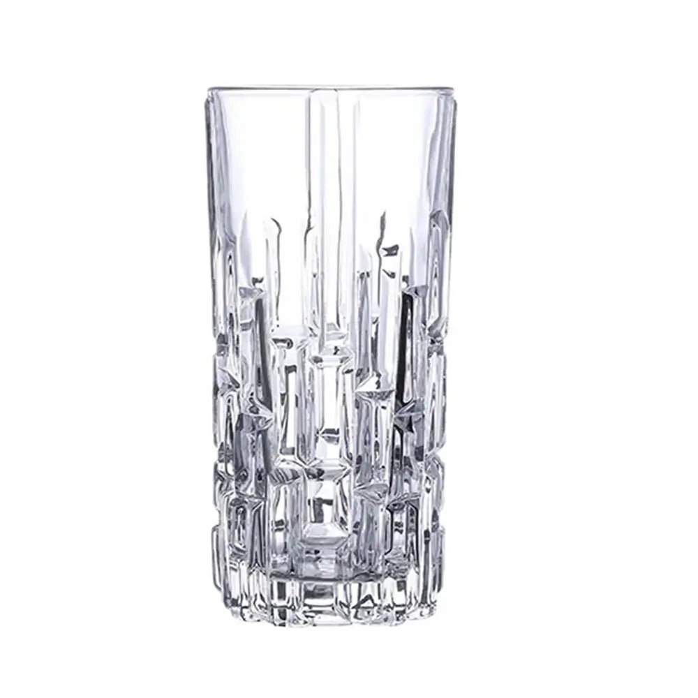 Crystal highball glass with geometric design on a white background.