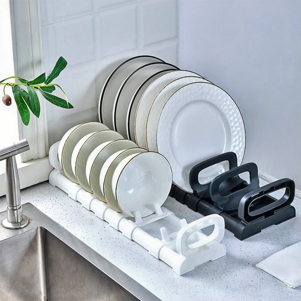 Organized plates and bowls in a kitchen drawer, neatly arranged with dividers for easy access and storage.