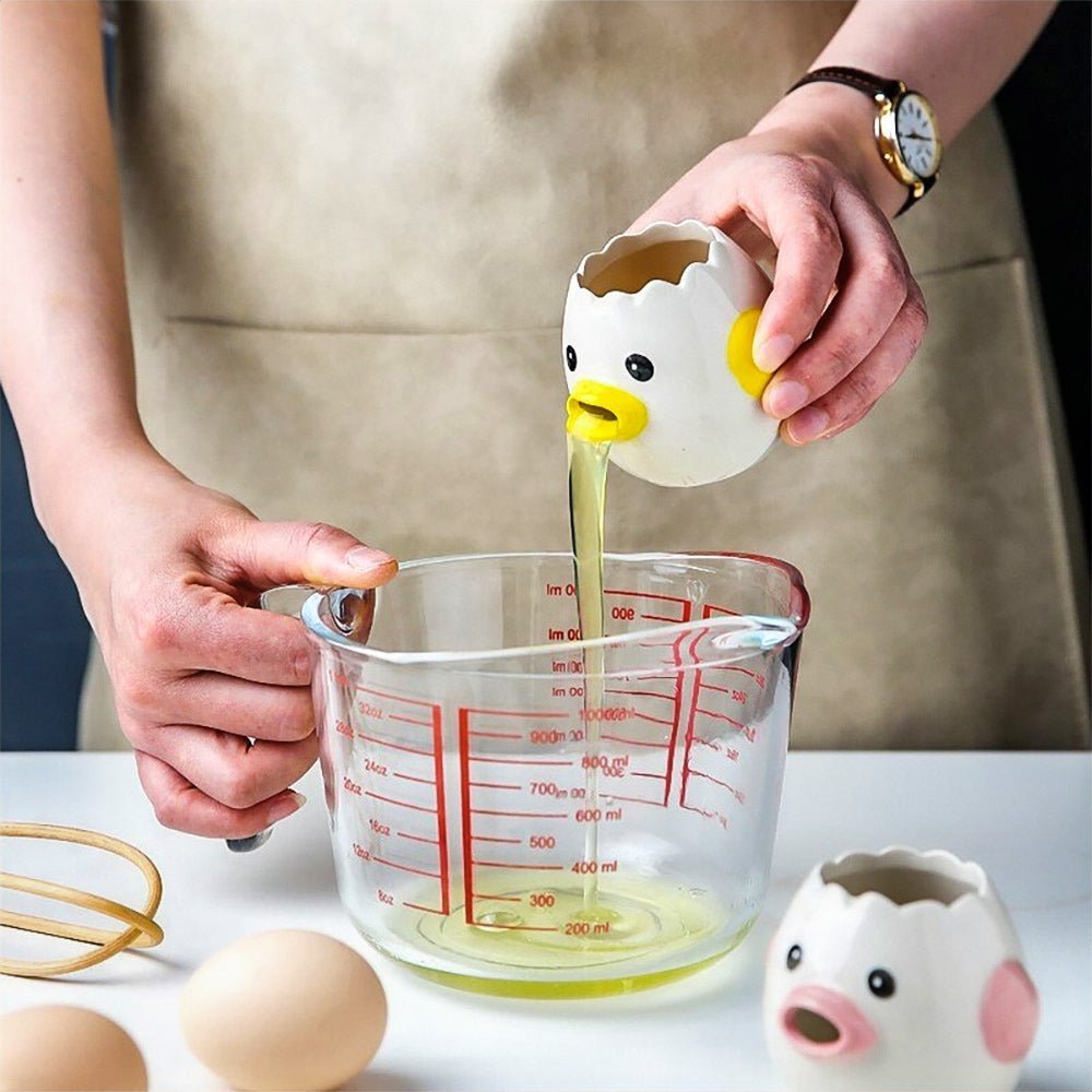 A woman demonstrates how to separate egg and yolk, using an egg separator to divide the yolk from the white in the kitchen quickly.