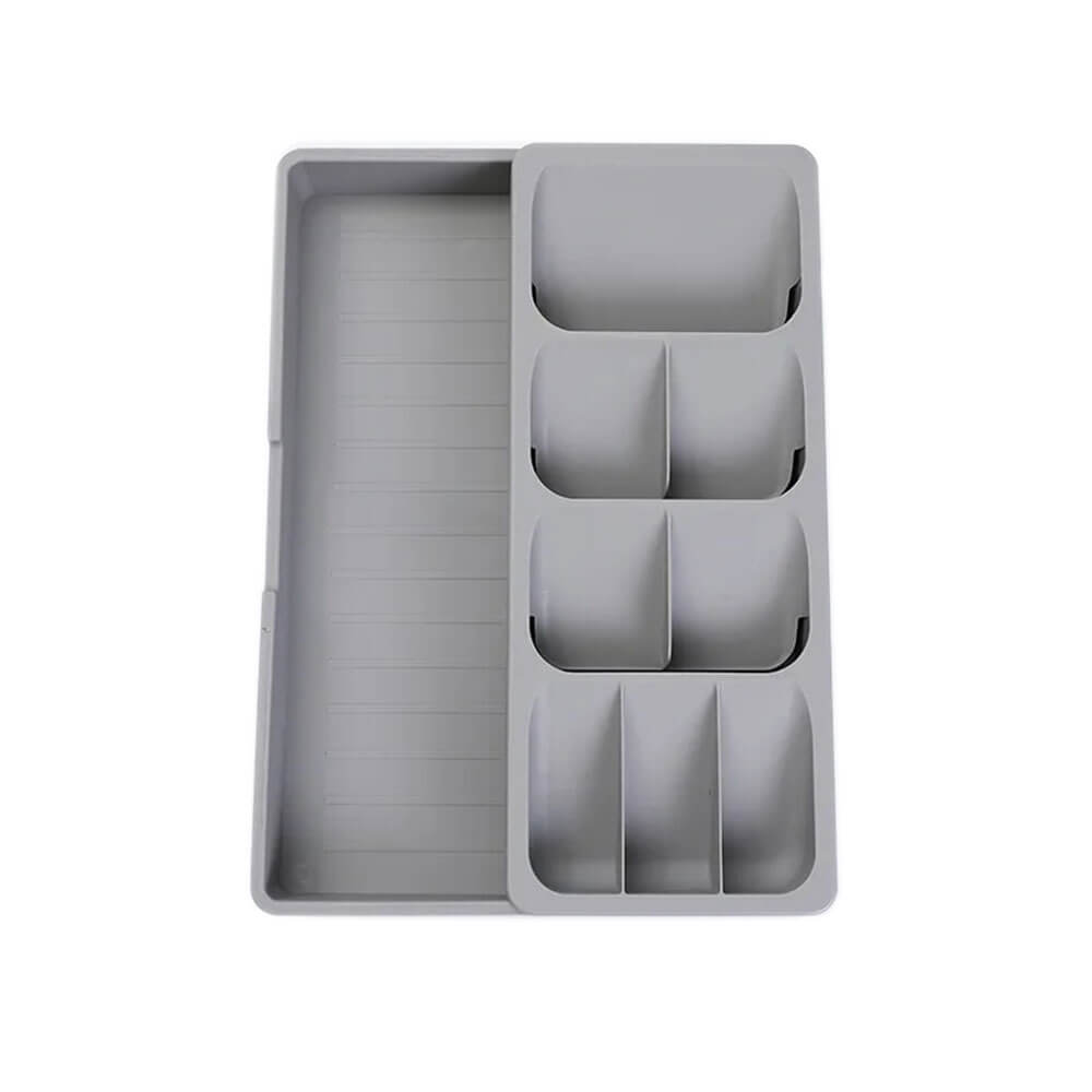 Gray in drawer organizer with multiple compartments for neatly storing utensils, cutlery, or tools in kitchen or office drawers.