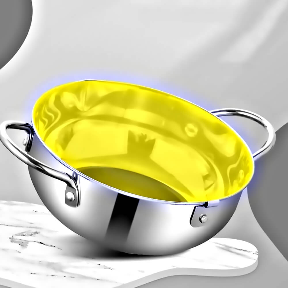 Japanese deep frying pot with yellow interior and side handles, placed on a white surface with a modern background.