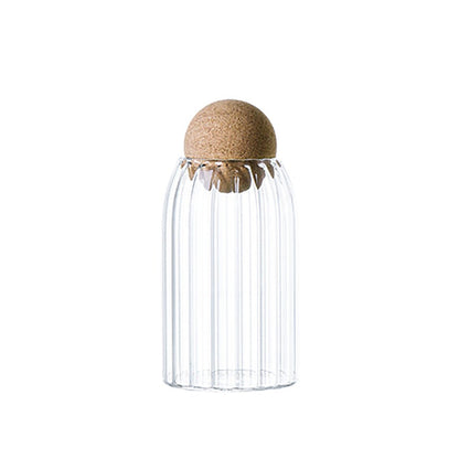 Glass jars with cork lids, ideal for stylish kitchen storage of pantry essentials.