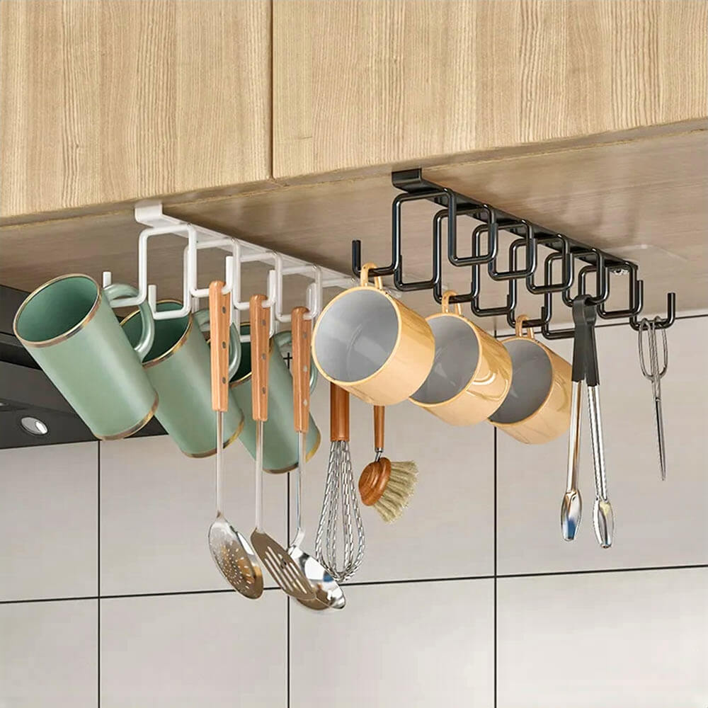 Versatile kitchen cabinet rack set in white, black, and gold, mounted under a wooden shelf, with multiple hooks holding mugs, utensils, and kitchen tools for a neat and stylish kitchen organization.