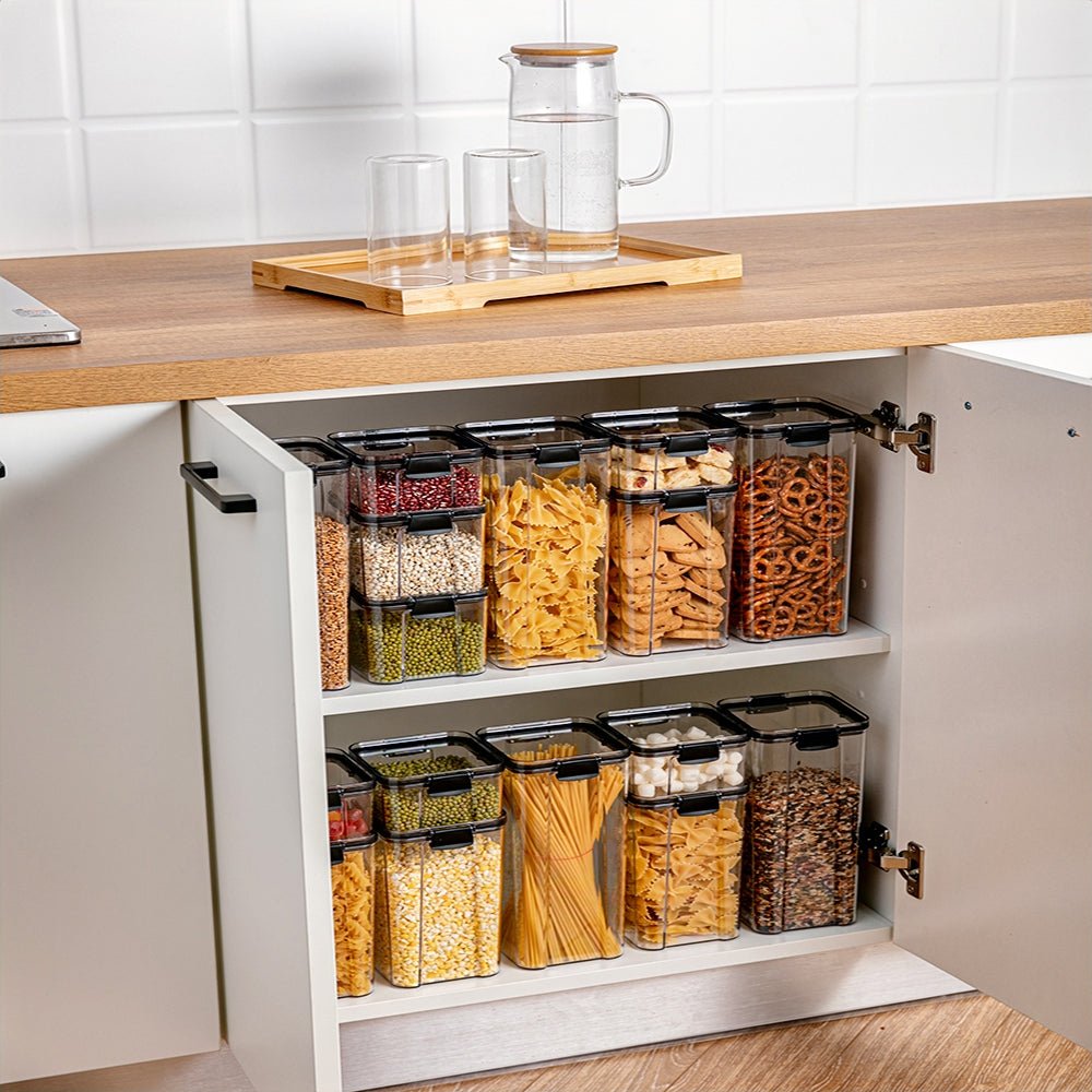 Set of plastic kitchen canisters in cabinet, organizing pantry essentials.