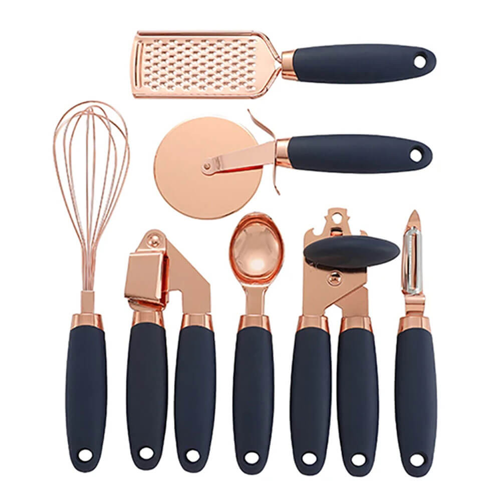 A sleek kitchen cooking tool set with copper utensils and black ergonomic handles, including a whisk, grater, pizza cutter, garlic press, ice cream scoop, can opener, and peeler, designed for modern culinary enthusiasts. 