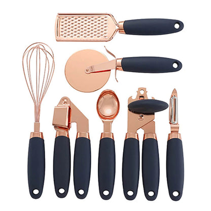 A sleek kitchen cooking tool set with copper utensils and black ergonomic handles, including a whisk, grater, pizza cutter, garlic press, ice cream scoop, can opener, and peeler, designed for modern culinary enthusiasts. 