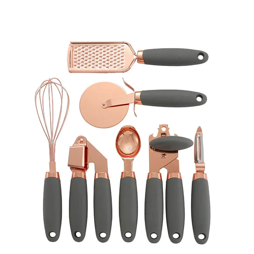 A sleek and modern kitchen tools set with eight pieces. The tools include a whisk, grater, pizza cutter, garlic press, ice cream scoop, can opener, and peeler. Each tool features a sophisticated rose gold metallic finish complemented by soft, dark gray ergonomic handles for comfortable use.