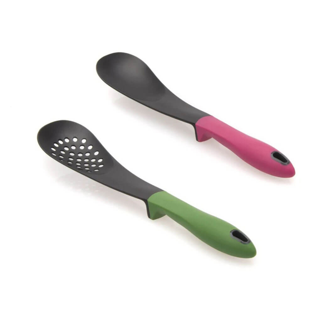 Two tools from kitchen utensils sets, a solid spoon with a pink handle and a slotted spoon with a green handle, on a white background.