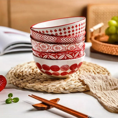 A set of 5 KitchenAid ceramic bowls, each with a distinct red pattern, perfect for mixing and serving in style.