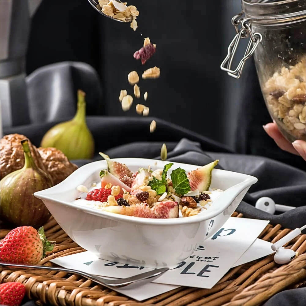 Stylish large serving bowl filled with fresh figs, strawberries, and granola, showcasing a modern square design ideal for presenting salads, desserts, or breakfast spreads.