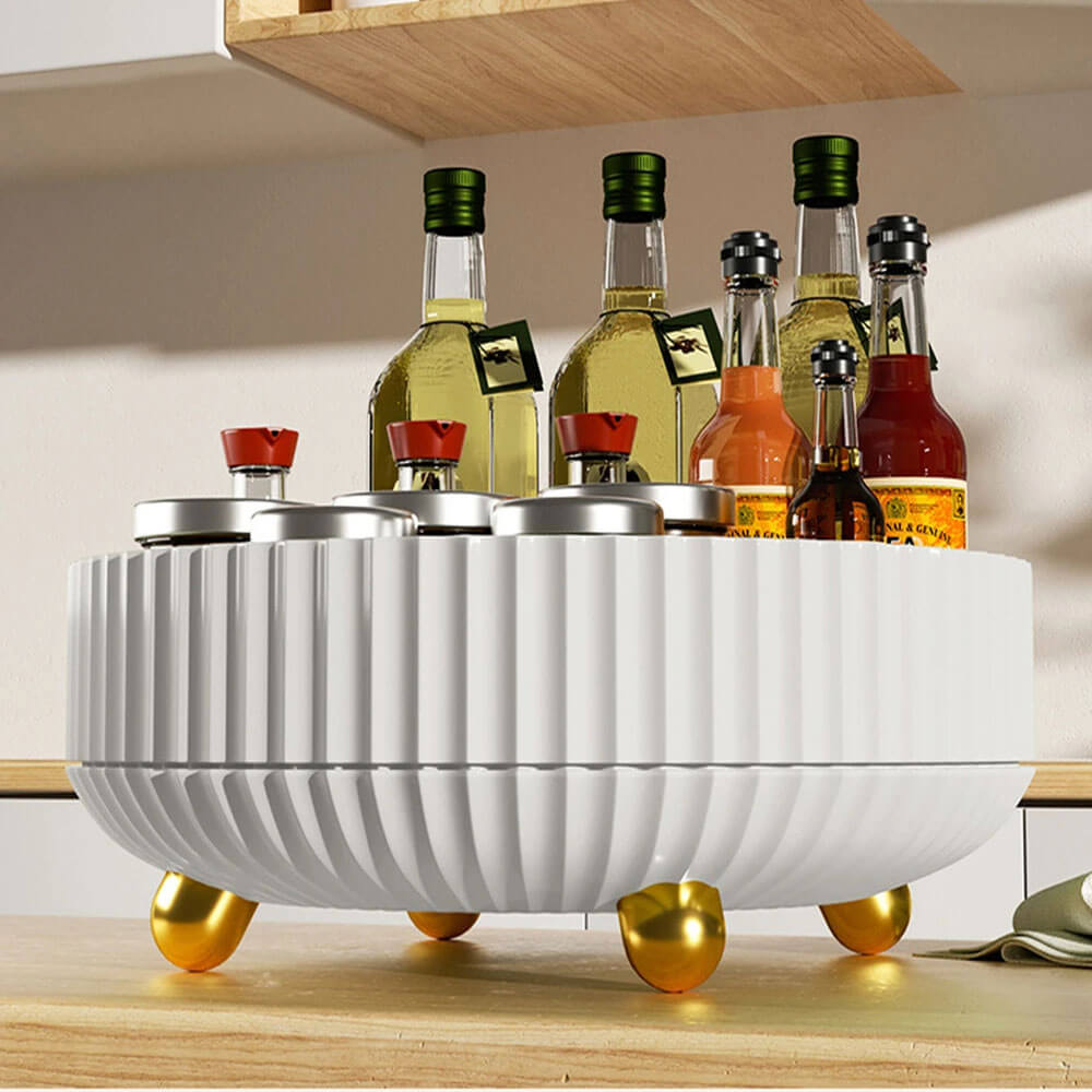 Lazy susan rotating tray holding bottles and jars, perfect for organizing kitchen spices, oils, and condiments on countertop.