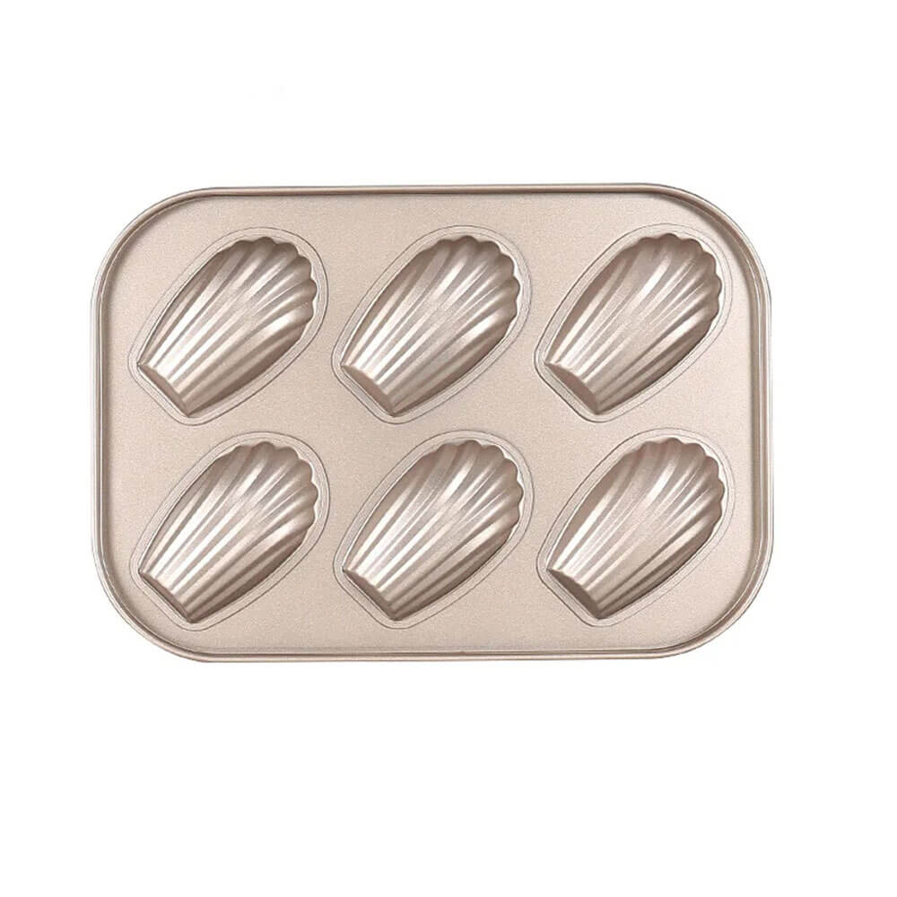 A rectangular madeleine baking pan made of carbon steel, featuring six shell-shaped molds. The pan has a smooth, non-stick surface and is designed for creating perfectly shaped madeleine cookies with a classic scalloped pattern. 