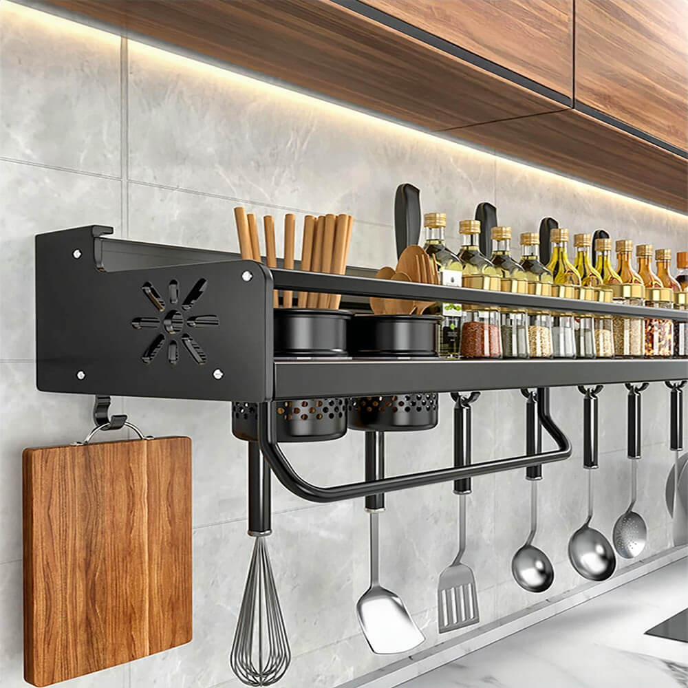 Wall mounted magnet kitchen storage rack holds spices, utensils, and bottles with hooks and containers for organized access.