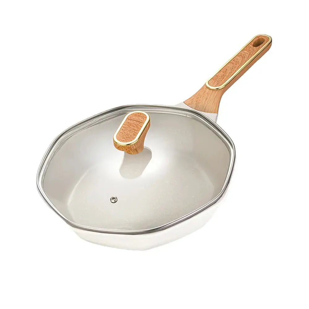 Wok with wooden handle and glass lid on a white background