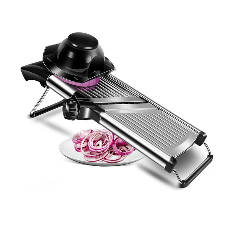 Mandoline slicer with adjustable thickness, slicing red onions onto a plate, featuring stainless steel blades and safety holder.