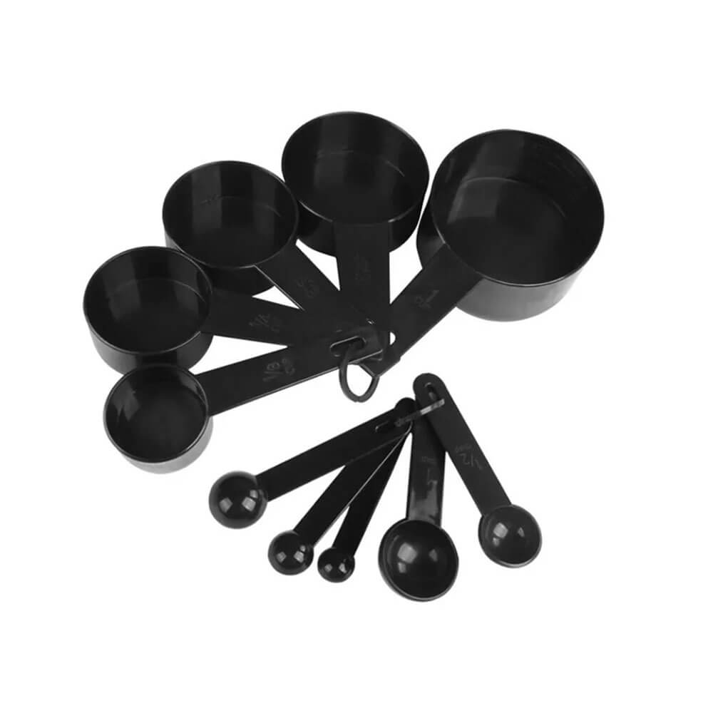 Set of black plastic measuring cups and spoons in various sizes, fanned out and held together with small rings.