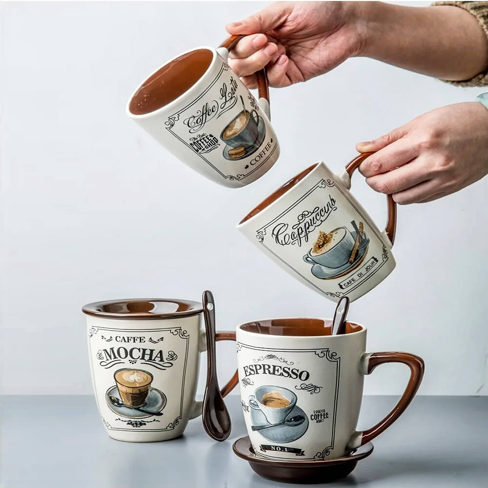 Set of vintage-style microwavable ceramic mugs with lids, featuring coffee-themed prints like Mocha, Latte, Cappuccino, and Espresso. Each mug includes a spoon and is safe for microwave use, combining practicality with classic design.