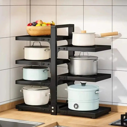 Black multi-tiered kitchen shelf with pots and pans on a tiled wall background