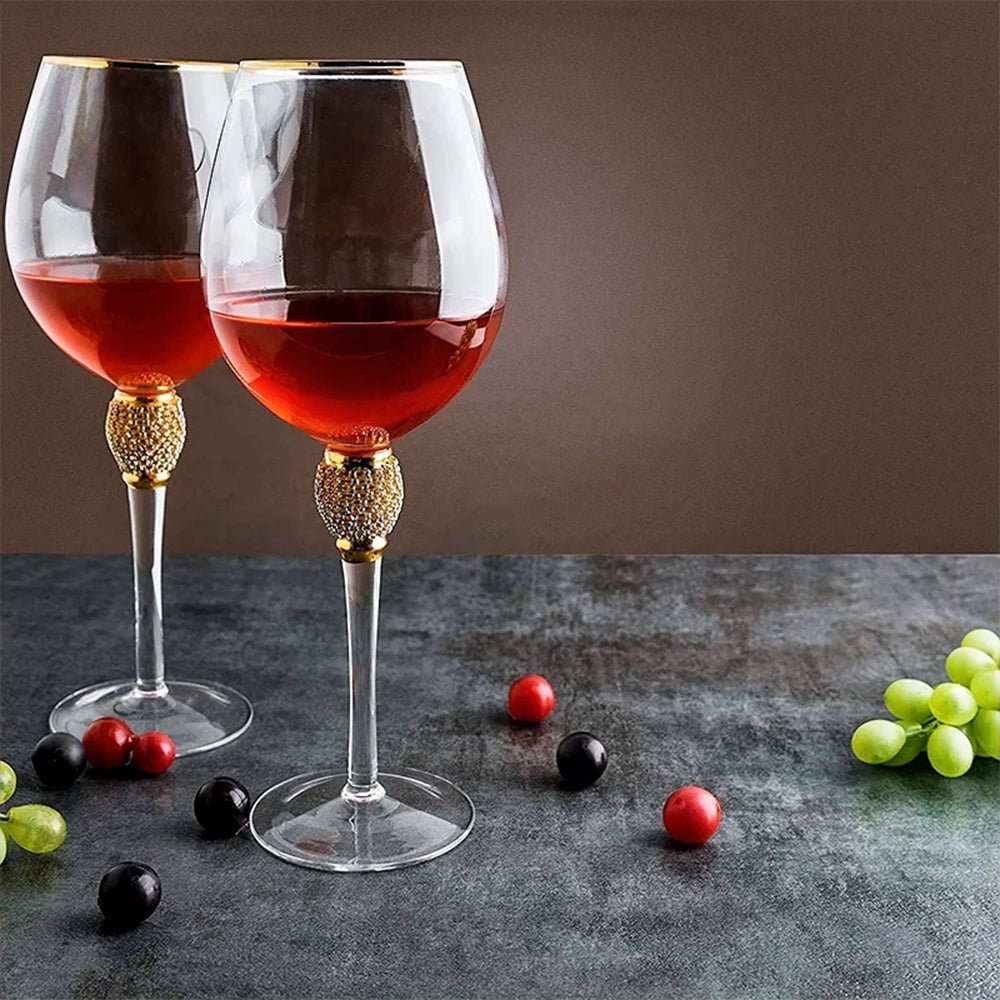 Two outdoor drinking glasses with a red beverage, placed on a dining table, ready for entertaining.