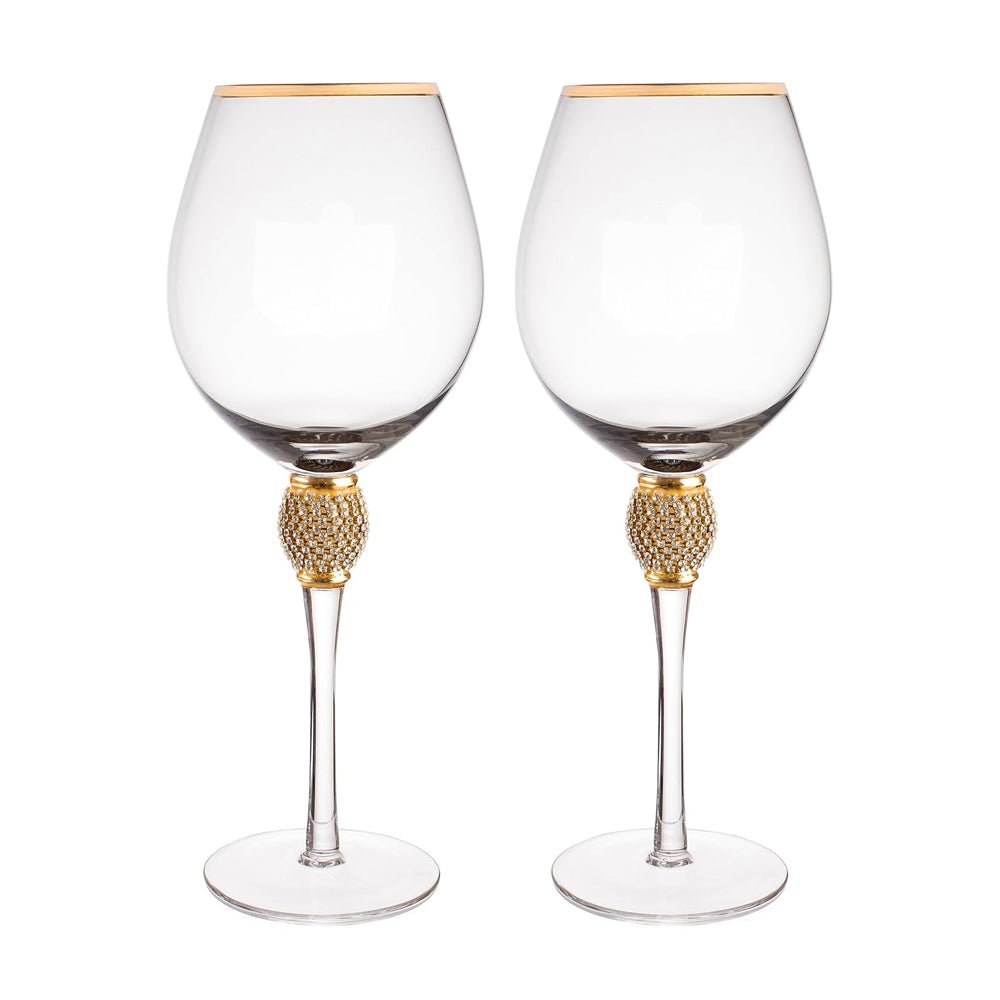 Two elegant outdoor glasses with gilded rims and diamond-like rhinestone accents, perfect for any event.