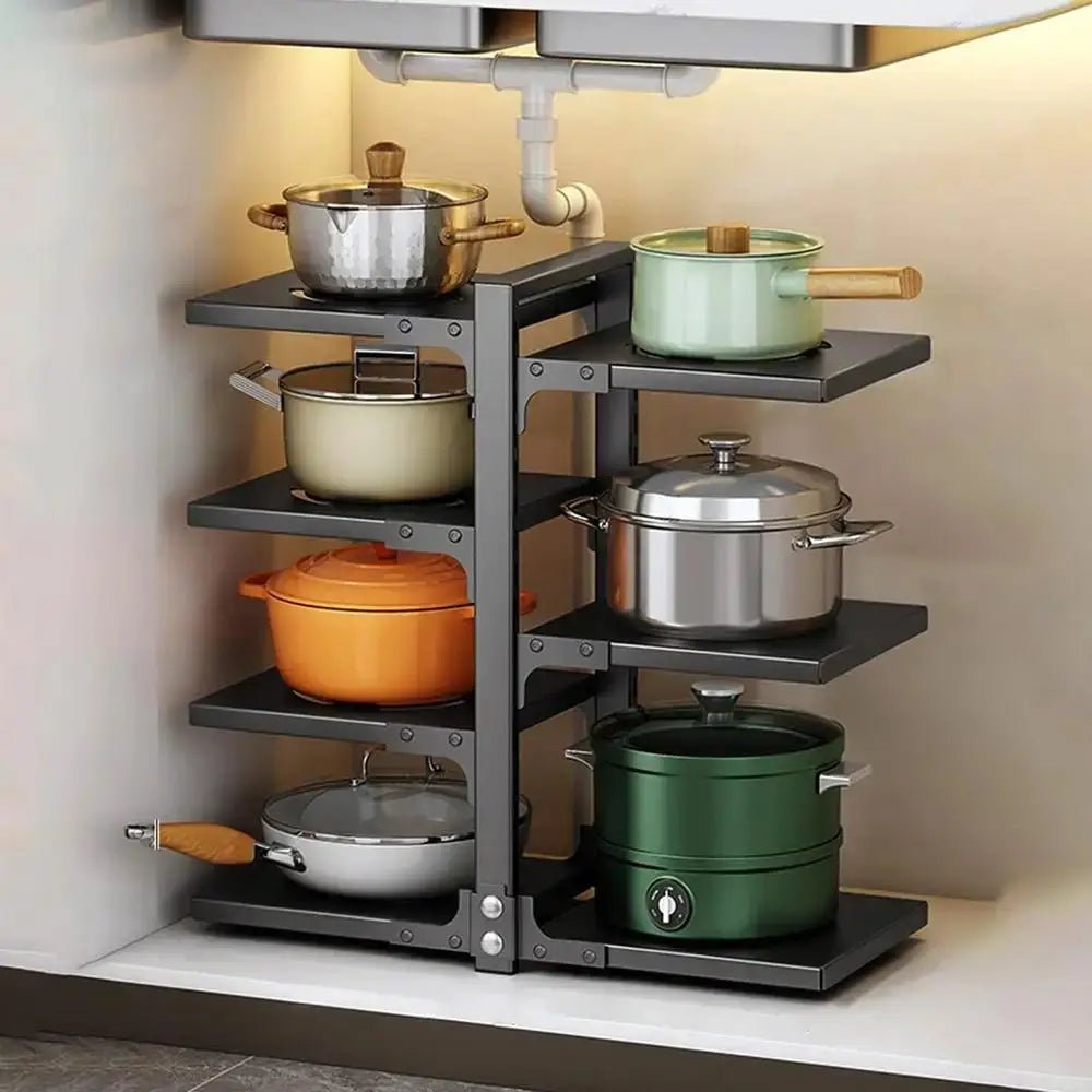 Kitchen cabinet with black pan and pot organizer holding multiple pots and pans on adjustable shelves under the sink.