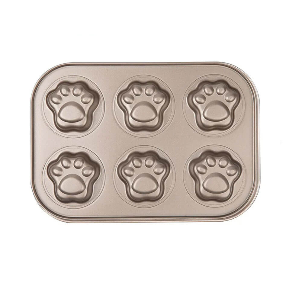 A durable, non-stick paw print baking pan made of carbon steel, featuring six adorable paw-shaped molds, perfect for creating fun and unique baked treats.