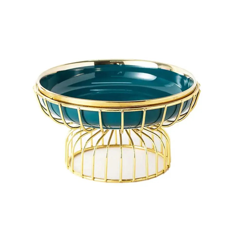 Elegant pedestal fruit bowl with teal glass dish and gold wire stand, modern decorative centerpiece for table or counter.