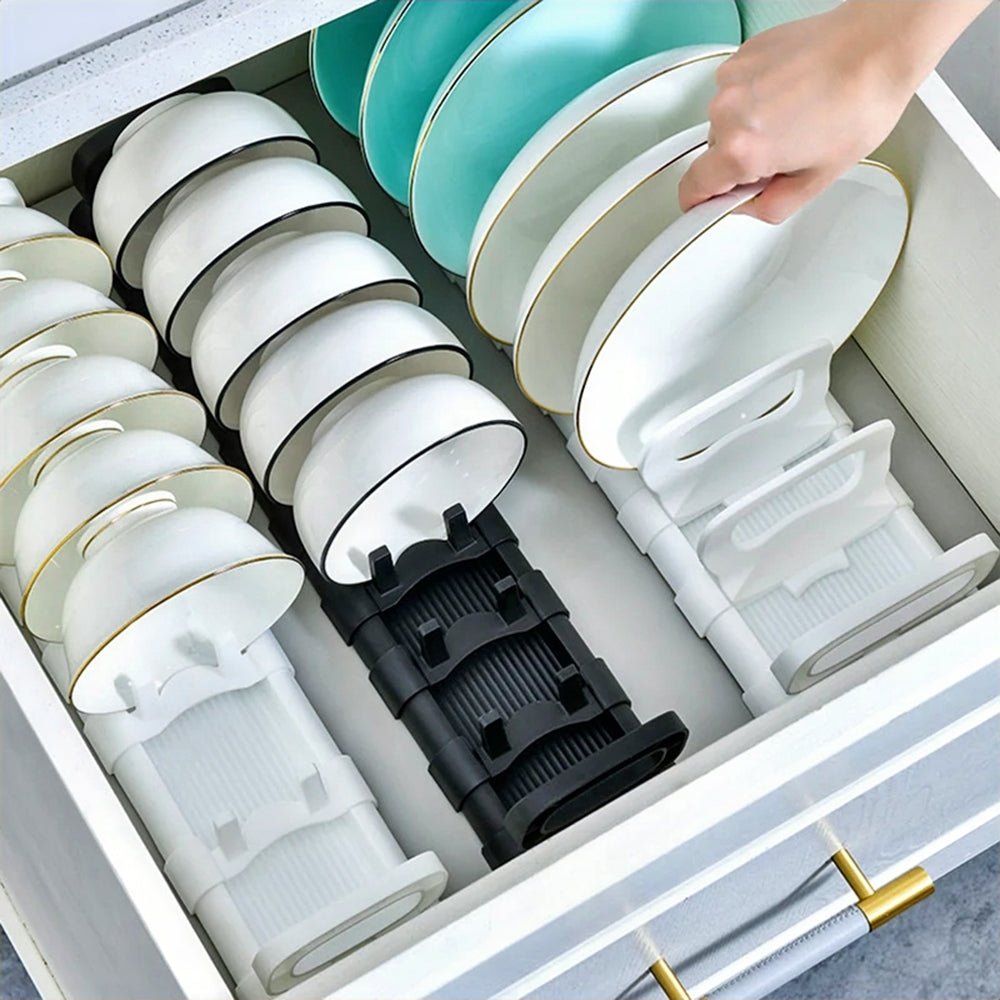 Plate and bowl organizer inside a kitchen drawer, neatly storing dishes and bowls in one place.